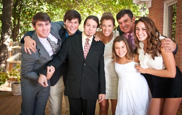 family posing at formal occasion