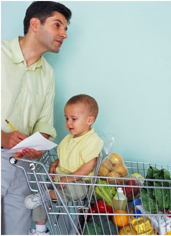 Father and child grocery shopping