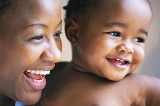 Smiling mother and baby